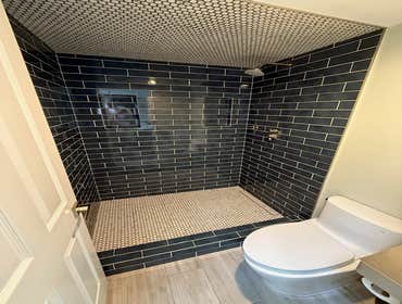 Photos by Purflo plumbing LLC #1 Custom 3’x5 subway tiled shower with mitered joints
