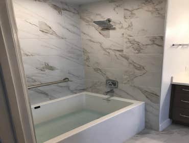 Photos by Pacific Proworks Inc. Untouched 1980's Bathroom Upgraded and full remodeling going from cast iron to copper piping, new lighting and installi