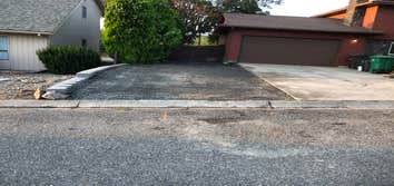 Photos by Houston Construction LLC #1 Excavation of area 8” down, developed a retaining wall , trucked in 21 tons of gravel to make a extra parking are
