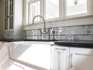 Baine Contracting Inc Project Multiple jobsites - showing kitchens, interior and exterior trim work, new homes, bathrooms, tile work, wood and iron ra