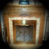 Original Fire Place Design Saved Existing Mantle, and Refurbished old brick face with Tumble Stone.
