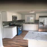 Kitchen , load bearing wall removed , new windows and living room complete