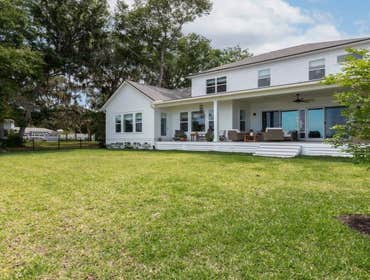 Bells River Residence Nestled in the serene Waterman’s Bluff in Yulee, FL, this exquisite home offers 3,046 sq ft of living space, expanding to a total