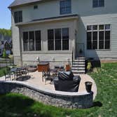 Patio and fence in Laurel, MD We created a great outdoor family space with a patio, sitting wall, landing are and fencing.