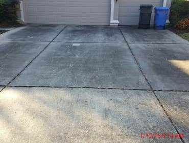 Photos from Popa Construction LLC Before & Afters of a soft wash roof cleaning and driveway and side walk cleaning.