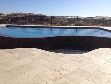 Reverse negative edge Travertine deck, spa, reverse negative edge play pool,