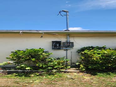 Replacement service with higher mast secured to code compliance