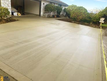 Concrete Driveway Brand new concrete driveway, with before and after photos for representation.
