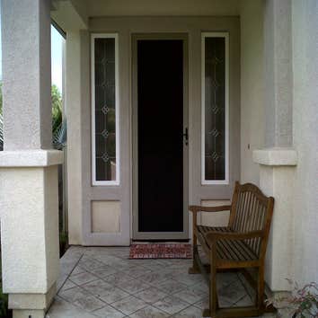 TRU View Security Screen Door Stainless steel epoxy coated mesh. No more unsightly bars. Beautiful view looking out. Affords daytime privacy.