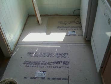 Photo(s) from Laur Moor Construction Two decks and a tiled kitchen floor