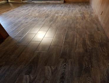 Flooring Was originally carpet and then it was transformed into tiles the choice was the owners and it came out great