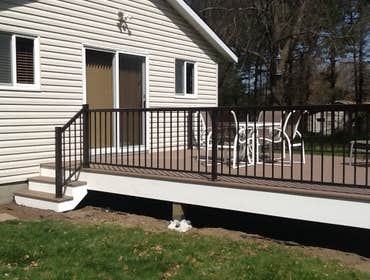 Photos by Custom Home Specialties Inc #2 Timber Tech maintenance free decks with powder coated railings.