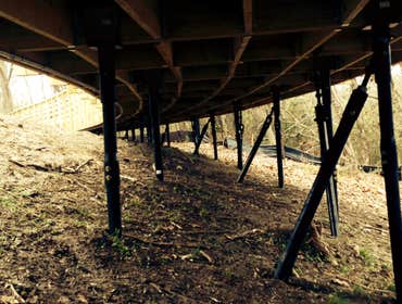 Photo(s) from RamJack Mississippi LLC Boardwalk helical piles with battered piles. Bridge abutment piles