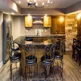 Basement remodel with kitchen, wetbar, bathroom, living area and bedrooms This basement was completely unfinished. The homeowner had us add a kitchen, 
