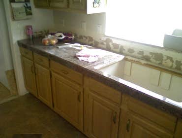 Othello Kitchen Granite/Porcelain Tile Work Kitchen Countertops and Backsplash done in Granite tile with hand beveled and polished edges and floors don