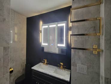 Deveshram Bathroom Complete interior bathroom renovation including installation of a custom standing shower and jacuzzi tub, premium marble tile on flo