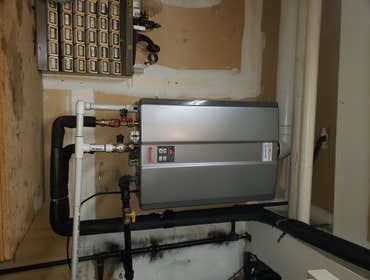 Tankless water heater install Demo old water heater, relocate water and gas piping approx 15 ft. Mount and install new tankless water heater in new loc