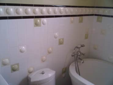 optima views condominiums Remodeling of entire Kitchen And Bathroom new cabinetry, flooring, and stone wall .
