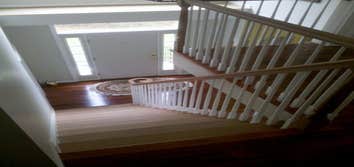 Cherry Staircase installation The customer wanted to remove the carpenting on the stairs and the the wobbly painted stair railing. The chose custom che