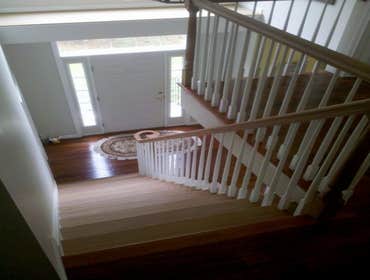Cherry Staircase installation The customer wanted to remove the carpenting on the stairs and the the wobbly painted stair railing. The chose custom che