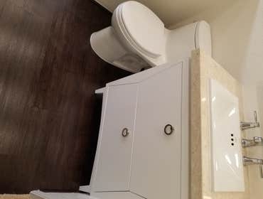 V. Jones Bathroom/Laundry Room Remodel - Tub to Step-in Shower Conversion with Linear Drain
- New Vanity, Toilet, Sink, mirror, toiletries
- All new fl