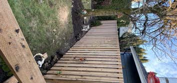 Photos by Unlimited Home Solutions #3 Remove and dispose 60ft of old cedar fence. Install new posts and cedar good neighbor fence.