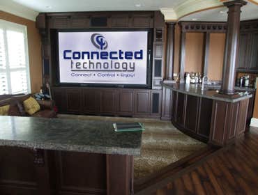 Various photos of a couple of the many professional installations Connected Technology has done. From full-blown home theaters to music, lighting contr