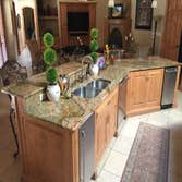 Corrales Home Granite Countertops, 3cm Juperana Colombo Gold in the kitchen.