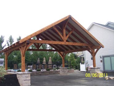 (2) Custom designed timber-framed pergola, timber-framed carport Each timber is hand carved to fit into the joining beam.