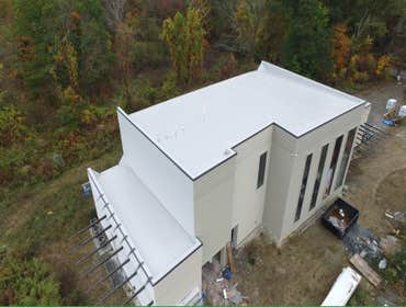 Roofing project using Duro-Last PVC by Maximus Builders