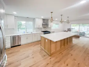Kitchen Remodel Canoga Park We transformed this Canoga Park kitchen into your modern masterpiece! Picture sleek white cabinets with a warm oak island, 