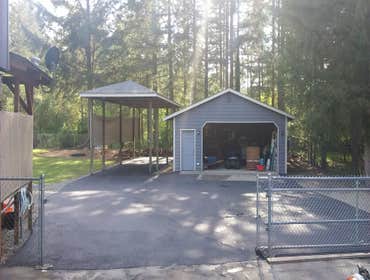 Auburn Driveway Exspansion & RV Parking Asphalt Paving of a driveway expansion and RV parking area included fine grading for drainage, crushed rock in