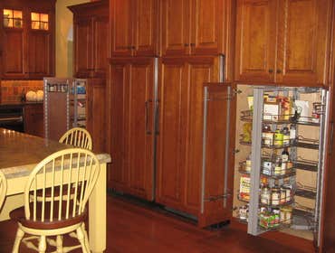 Mendham Kitchen Remodel This kitchen features a combination of cherry cabinetry, a yellow painted island and an antique green bar hutch. The custom c