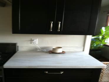 Photos by PS Carpentry LLC #1 The kitchen pictures, I hung and placed cabinetry in a galley kitchen. The deck pictures, we removed a couple beams and 