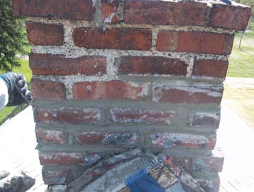 Project photos from Herman Roofing Chimney repoints and rebuilds