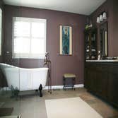 Walk-In Shower and double vanity Removed large soaking tub and small enclosed shower and replaced it with a large walk-in shower and freestanding soaki