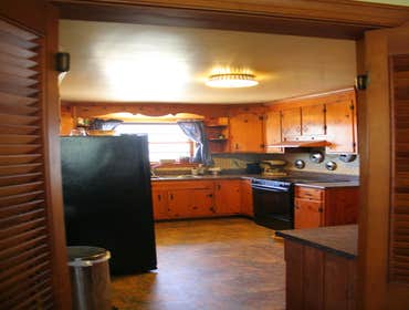 Jones Kitchen Kitchen renovation which included: removal of old and installation of new floor, new counter top installation and new corner cabinets. C