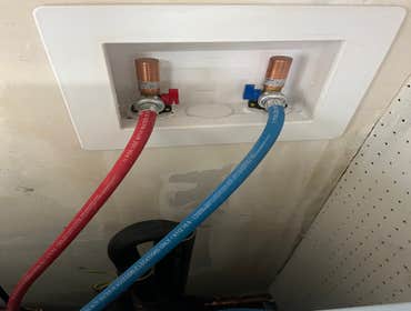 Flush mount box with supply lines for washer