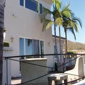 Chris Matthews Painting Project Exterior painting of two-story home and exterior wall fence, staining of deck, stairways and doors. San Diego, CA