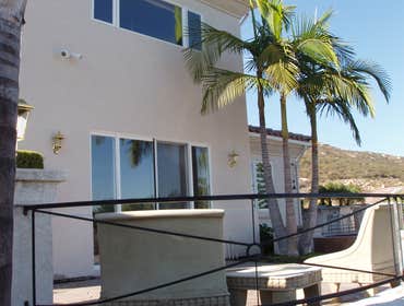 Chris Matthews Painting Project Exterior painting of two-story home and exterior wall fence, staining of deck, stairways and doors. San Diego, CA