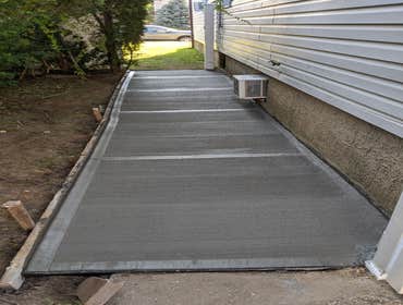 Photos by Kaba Ks Corp #3 I'm front driveway and sidewalk brand new concerete with 4000psi and on sidewalk of building make 5 feet walkway with concere