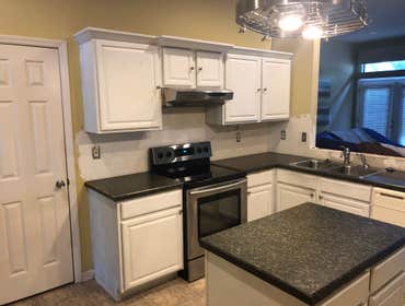 Photos by Fast Track Builders, Inc #2 Removed the wall between the kitchen and dinning room, renovated kitchen cabinets and countertops.