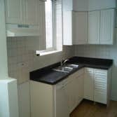 optima views condominiums Remodeling of entire Kitchen And Bathroom new cabinetry, flooring, and stone wall .