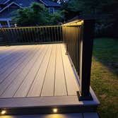 Modern PVC Deck with Integrated LED Stair Lighting This premium low-maintenance deck was built using TimberTech Advanced PVC decking in Coastline with 