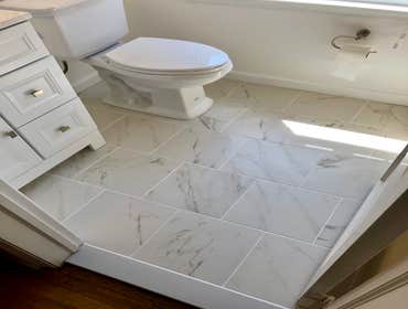 Photos by Elite Homes LLC #6 Minor bathroom update- new tile floor, vanity, medicine cabinet and fresh paint