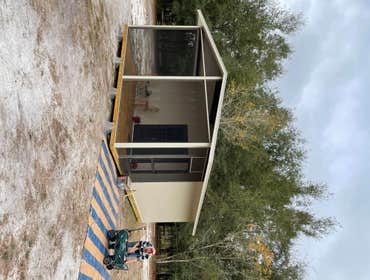 Photos by Big Water Custom Homes & Realty Inc Insulated Panel Cabin with Screen Porch
