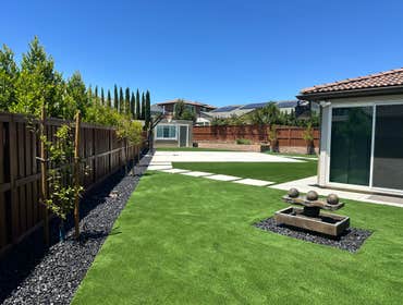 Photos by Cornerstone Hardscape #3 Backyard Hardscape & Artificial Turf Installation
Complete backyard transformation featuring a clean, modern, low-m