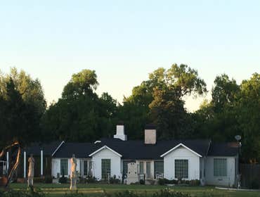 After: A crisp & fresh look- thanks to a new roof, restored timbers and new paint