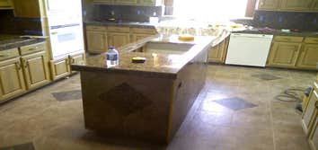 Othello Kitchen Granite/Porcelain Tile Work Kitchen Countertops and Backsplash done in Granite tile with hand beveled and polished edges and floors don