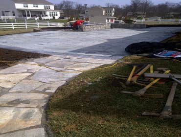 Paver Patio and Walkway This is a a combination of some of our work. Landscaping box and Veneer retaining wall, walkway and flagstone patio.